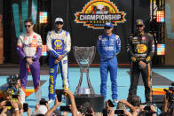 From left to right, Denny Hamlin, Chase Elliott, Kyle Larson, and Martin Truex Jr. pose before a NASCAR Cup Series auto race on Sunday, Nov. 7, 2021, in Avondale, Ariz. (AP Photo/Rick Scuteri)