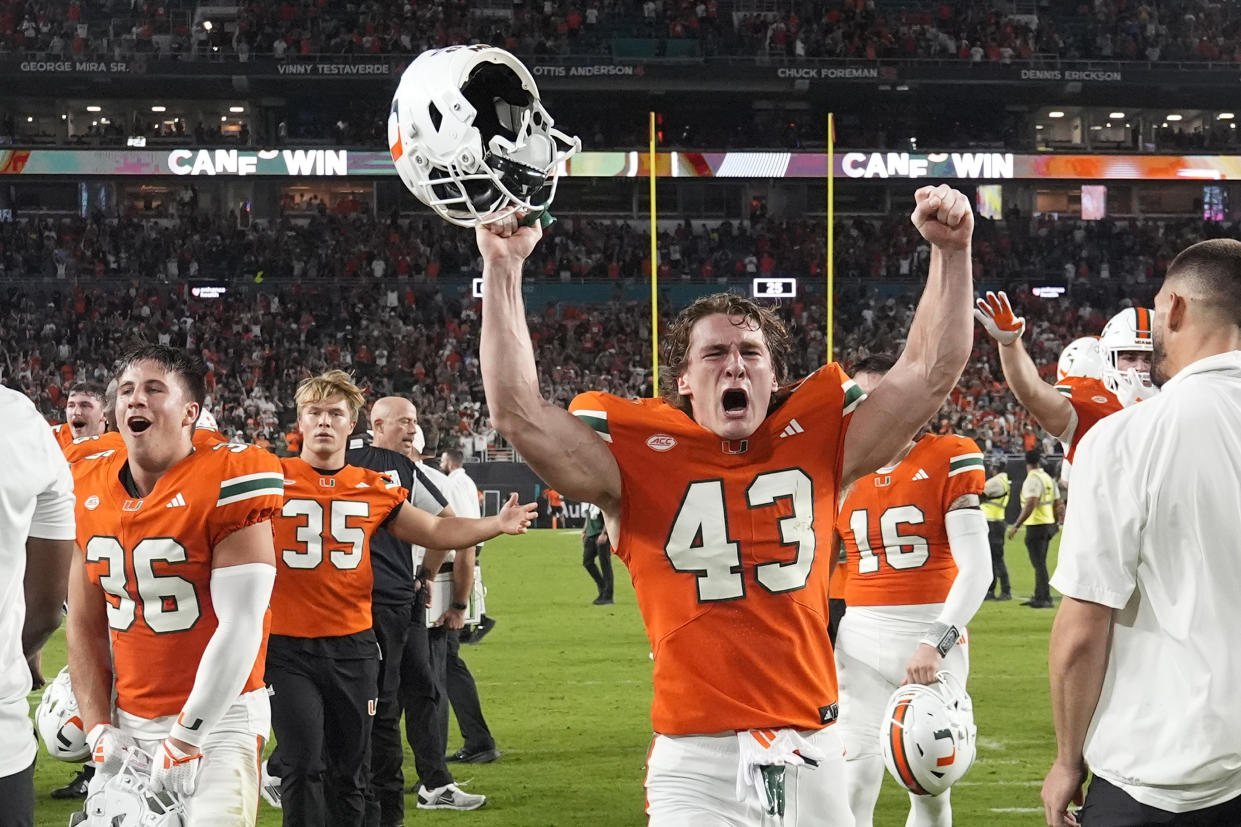 Miami's wide receiver Andrew Cohen (43) celebrates at the end of an NCAA college football game against Virginia Tech, Friday, Sept. 27, 2024, in Miami Gardens, Fla. (AP Photo/Marta Lavandier)