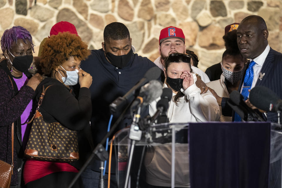 Family members of the deceased Daunte Wright, from left, Angie Golson, grandmother, Naisha Wright, aunt, Aubrey Wright, father, Katie Wright, mother, and the family's attorney Ben Crump, right, attend a news conference at New Salem Missionary Baptist Church, Thursday, April 15, 2021, in Minneapolis. (AP Photo/John Minchillo)