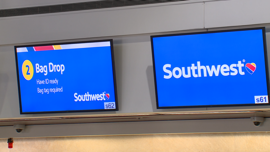 Signs above the Southwest Airlines check-in counter at Harry Reid International Airport (LAS). (KLAS)