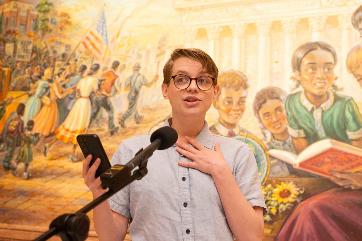 Isaac Johnson, a social work intern for Topeka Public Schools USD 501, shares his thoughts on social transitioning during a rally Thursday afternoon at the Statehouse.