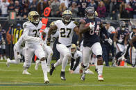 Chicago Bears wide receiver Cordarrelle Patterson (84) heads to the end zone for a touchdown on a kickoff return ahead of New Orleans Saints' Saquan Hampton (33) and Dwayne Washington (27) during the first half of an NFL football game in Chicago, Sunday, Oct. 20, 2019. (AP Photo/Mark Black)