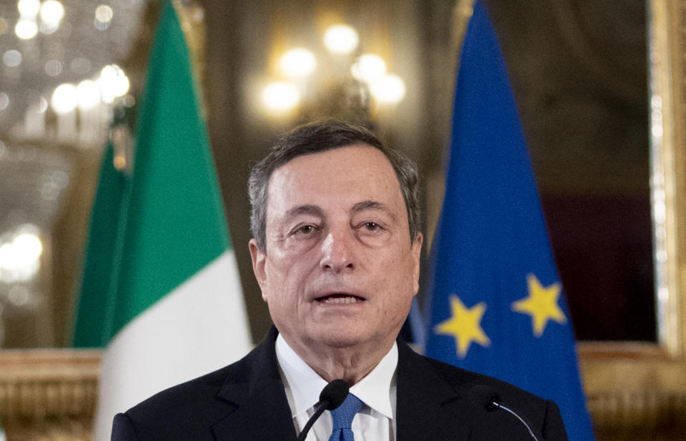 Former European Central Bank president Mario Draghi speaks to the media after accepting a mandate to form Italy's new government from Italian President Sergio Mattarella at the Rome's Quirinale Presidential Palace, Wednesday Feb. 3, 2021. (AP Photo/Alessandra Tarantino, Pool)