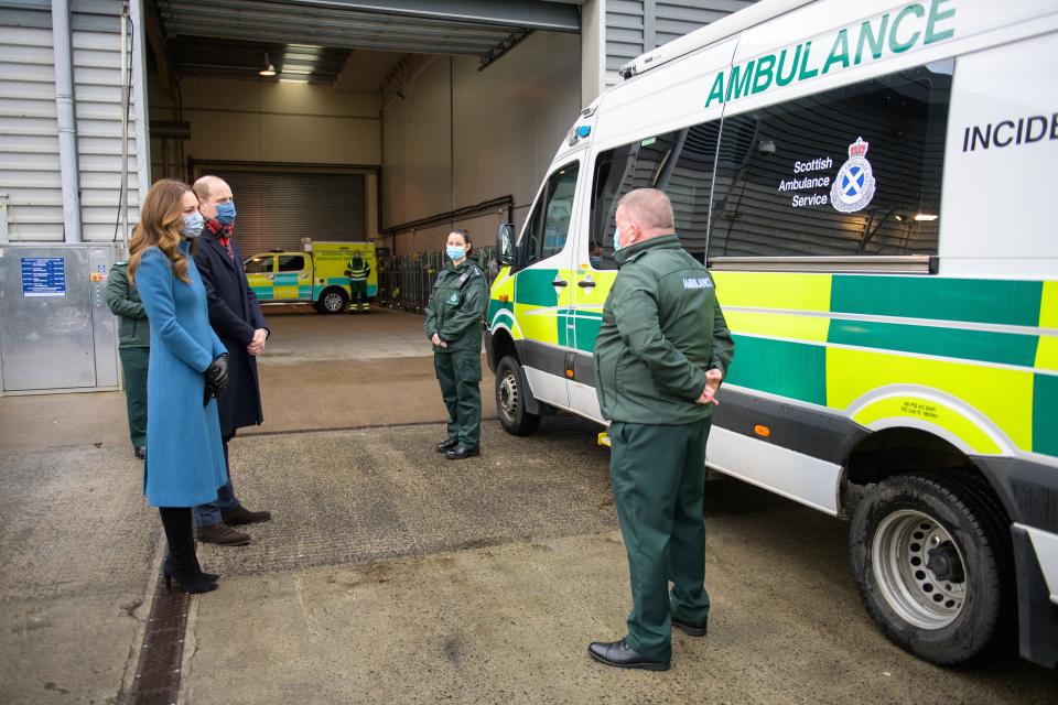 Britain's Prince William, Duke of Cambridge (2nd L) and Britain's Catherine, Duchess of Cambridge (L) speak with staff during a visit to the Scottish Ambulance Service Response Centre in Newbridge, west of Edinburgh in Scotland on December 7, 2020, on their first full day of engagements on their tour of the UK. - During their trip, their Royal Highnesses hope to pay tribute to individuals, organisations and initiatives across the country that have gone above and beyond to support their local communities this year. (Photo by Wattie Cheung / POOL / AFP) (Photo by WATTIE CHEUNG/POOL/AFP via Getty Images)