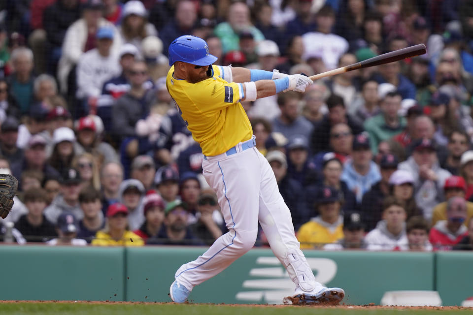 Boston Red Sox's Justin Turner hits a two-run home run in the third inning of a baseball game against the Los Angeles Angels, Sunday, April 16, 2023, in Boston. (AP Photo/Steven Senne)