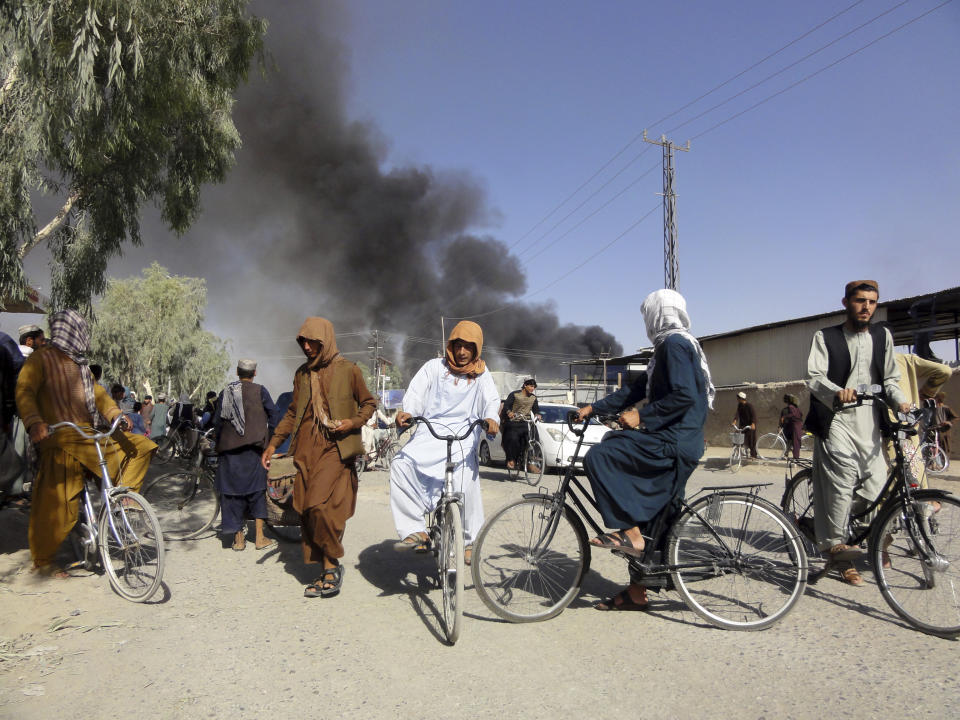 Smoke rises after fighting between the Taliban and Afghan security personnel, in Kandahar, southwest of Kabul, Afghanistan, Thursday, Aug. 12, 2021. (AP Photo/Sidiqullah Khan)