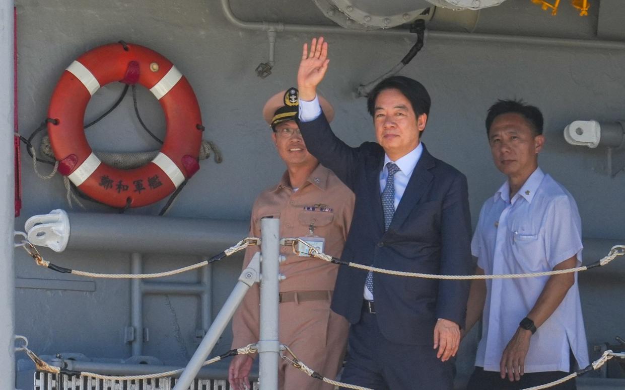 Taiwan President Lai Ching-te waves during a visit to inspect troops at the Navy 146 Fleet Dinghai Camp District