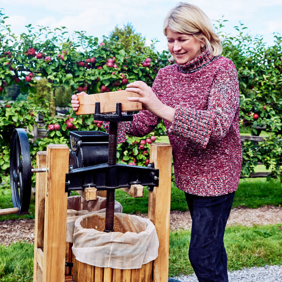 Martha turns her handcrafted American Harvester cider press from Happy Valley Ranch. | Paola + Murray