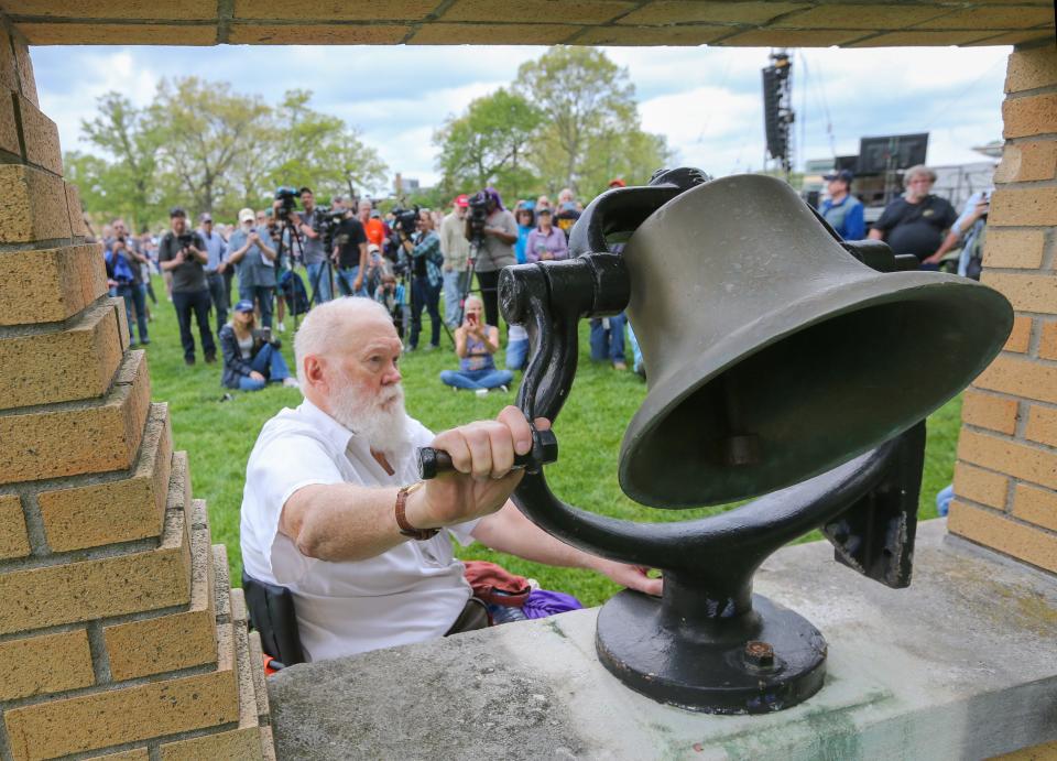 Dean Kahler, who was one of the nine students wounded by National Guardsmen on the Kent State campus May 4, 1970, rings the Victory Bell during a May 4 ceremony on the Commons on Saturday.