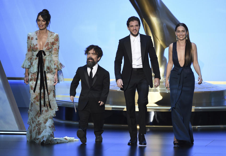 Lena Headey, from left, Peter Dinklage, Kit Harington and Emilia Clarke, of the cast of "Game of Thrones," appear on stage to present the award for outstanding supporting actress in a limited series or movie at the 71st Primetime Emmy Awards on Sunday, Sept. 22, 2019, at the Microsoft Theater in Los Angeles. (Photo by Chris Pizzello/Invision/AP)