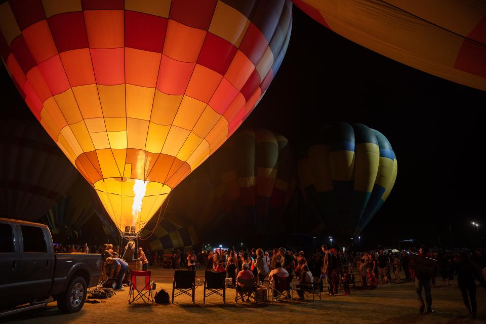 Pilot Bill Glen blasts the Heavens Quilt hot air balloon at the Spooktacular Hot Air Balloon Festival on Oct. 29, 2022, in Scottsdale.