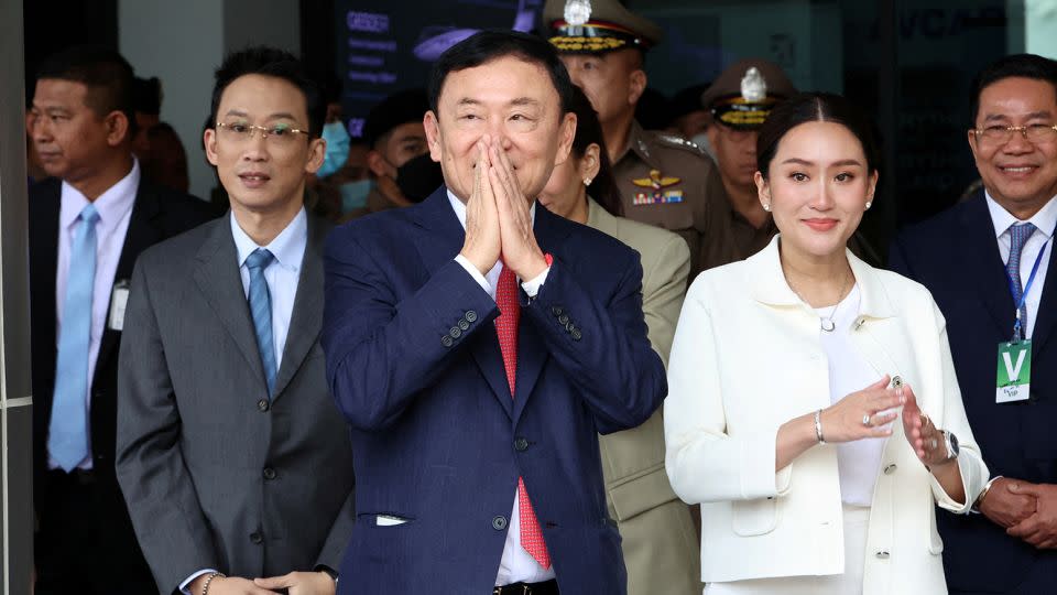 Former Thai Prime Minister Thaksin Shinawatra flanked by his son Panthongtae Shinawatra and daughter Paetongtarn Shinawatra at Don Mueang airport in Bangkok, Thailand August 22, 2023.  - Athit Perawongmetha