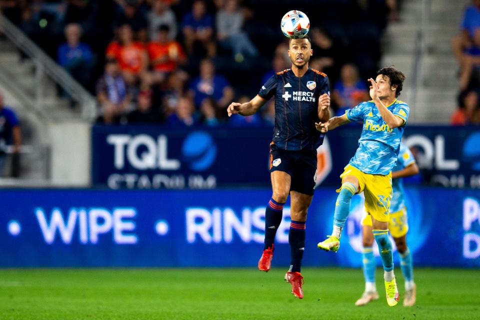 FC Cincinnati midfielder Haris Medunjanin (6) heads the ball as Philadelphia Union midfielder Paxten Aaronson (30) defends in the first half of the MLS soccer match between the FC Cincinnati and the Philadelphia Union on Saturday, Oct. 9, 2021, at TQL Stadium in West End. 