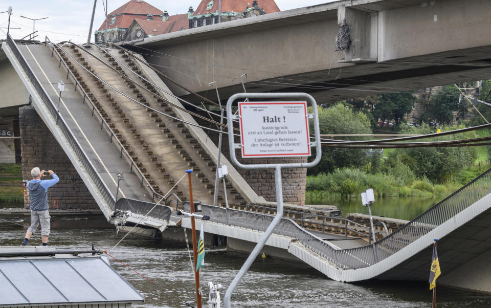 Parts of the Carola Bridge over the Elbe have collapsed in Dresden, Germany, Wednesday, Sept. 11, 2024. (Robert Michael/dpa via AP)