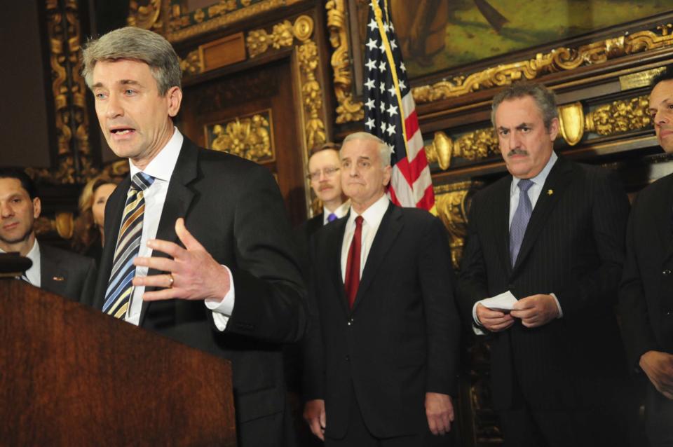 Minneapolis Mayor R.T. Rybak, along with Minnesota Governor Mark Dayton and Vikings' owner Zygi Wilf, speaks during a news conference about a deal reached among legislative leaders for a new Vikings stadium, Thursday, March 1, 2012, at the state capitol in St. Paul, Minn. The plan would put the new building nearly on top of the current Metrodome site. (AP Photo/The St. Paul Pioneer Press,Ben Garvin ) MINNEAPOLIS STAR TRIBUNE OUT