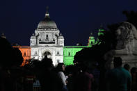 Victoria Memorial, the city's heritage icon is illuminated with colors of the Indian flag ahead of Independence Day celebrations in Kolkata, India, Sunday, Aug. 14, 2022. India will celebrate its 75th Independence Day on Aug. 15. (AP Photo/Bikas Das)