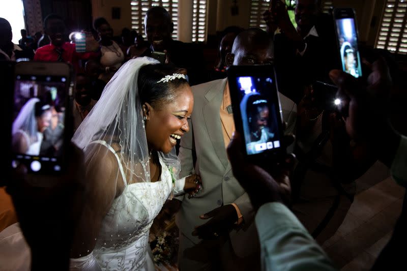 The Wider Image: Haiti's brides beat hurricanes, power cuts and protests to wed in style