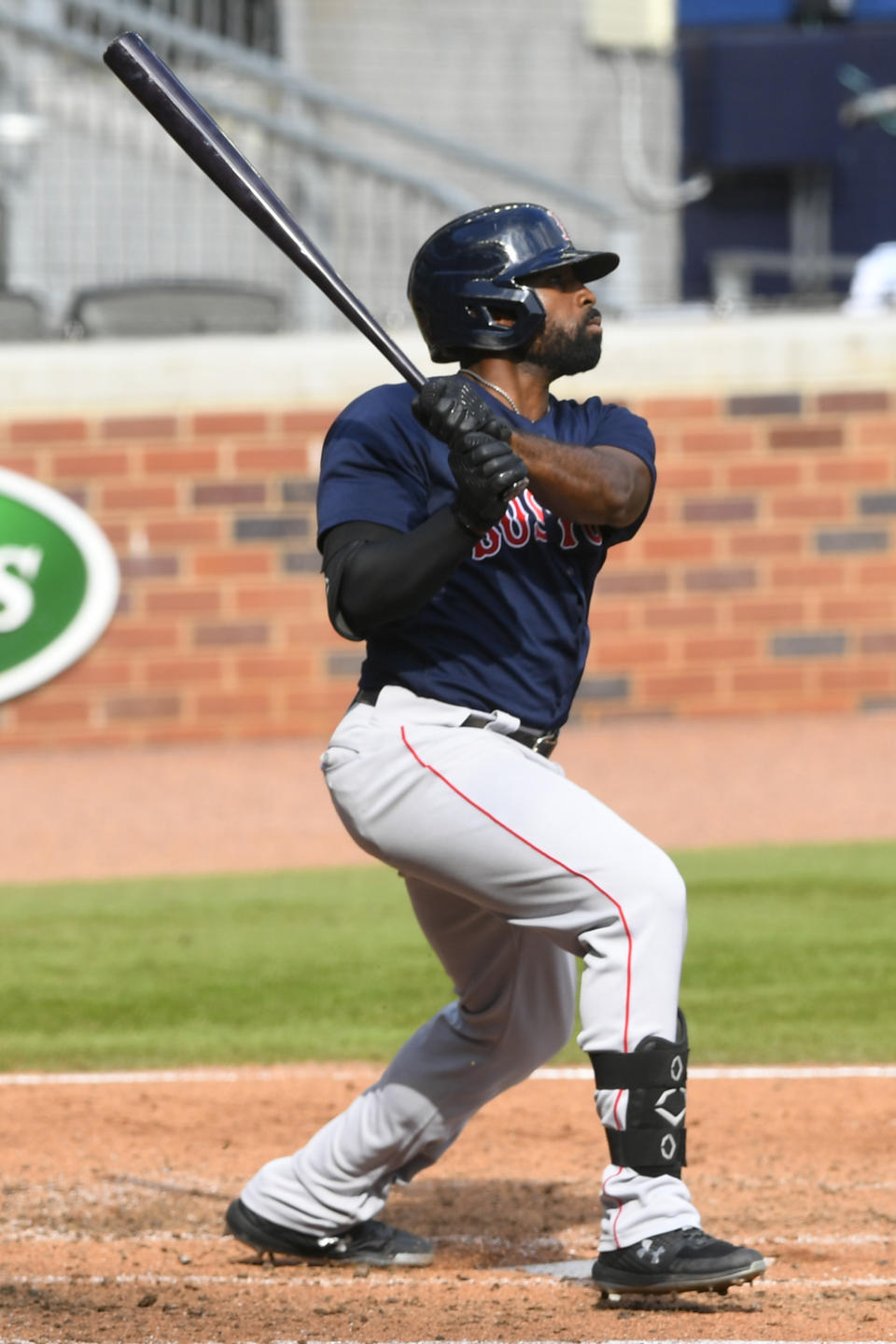 Boston Red Sox's Jackie Bradley Jr. watches his line drive soar to center field for a home run against the Atlanta Braves during the fourth inning of a baseball game Sunday, Sept. 27, 2020, in Atlanta. (AP Photo/John Amis)