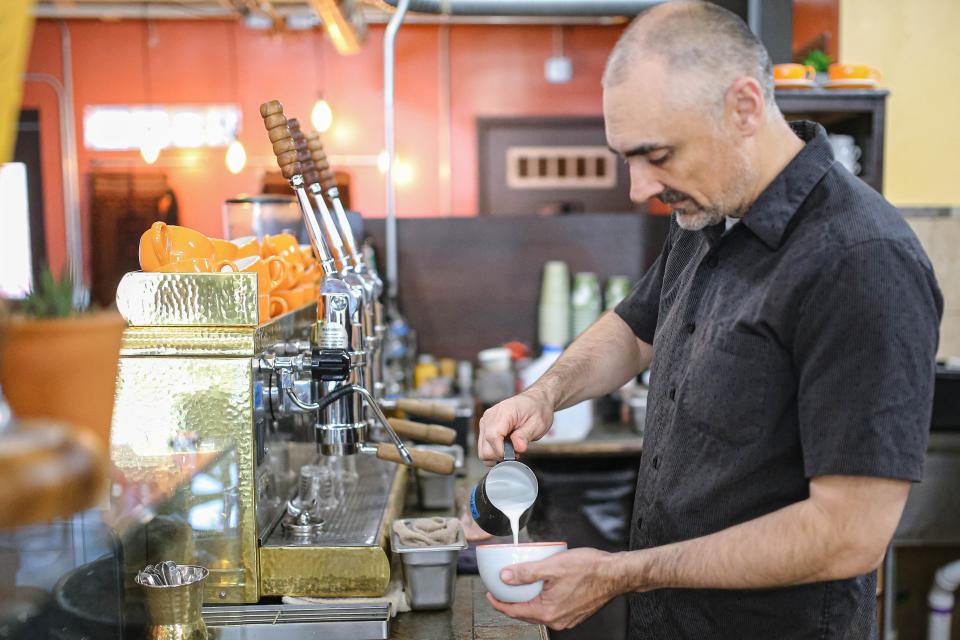 Owner Roy Baker makes coffee at Zero Tolerance Coffee and Chocolate in Oklahoma City.