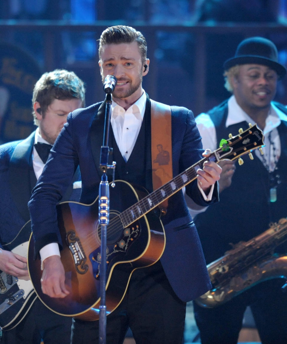 FILE - In this Nov. 24, 2013 file photo, Justin Timberlake performs on stage at the American Music Awards at the Nokia Theatre L.A. Live in Los Angeles. Timberlake has seven nominations at Sunday, Jan. 26, 2014 Grammy Awards, including best pop vocal album for “The 20/20 Experience” and solo pop performance for “Mirrors.” (Photo by John Shearer/Invision/AP, File)