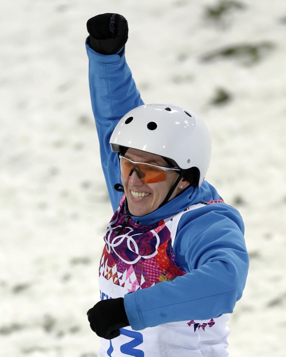 Alla Tsuper of Belarus celebrates after landing her final jump in the women's freestyle skiing aerials final at the Rosa Khutor Extreme Park, at the 2014 Winter Olympics, Friday, Feb. 14, 2014, in Krasnaya Polyana, Russia. Tsuper won the gold medal. (AP Photo/Andy Wong)