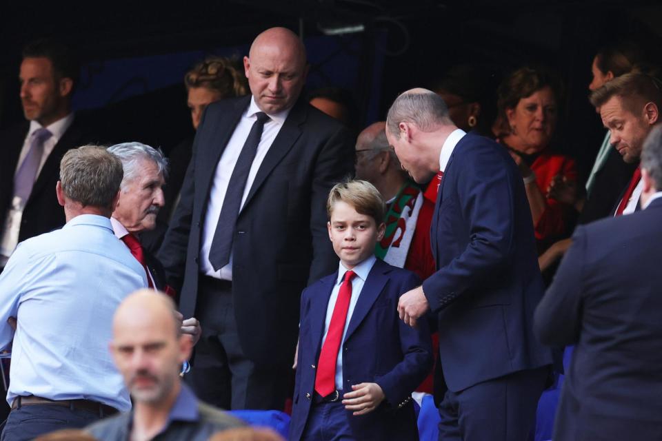 PHOTO: Prince George and William, Prince of Wales and Patron of the Welsh Rugby Union (WRU), interact prior to the Rugby World Cup France 2023 Quarter Final match between Wales and Argentina at Stade Velodrome, Oct. 14, 2023, in Marseille, France. (David Rogers/Getty Images)