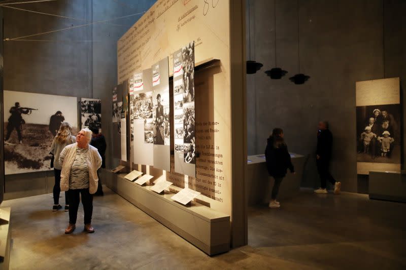 Visitors look at part of an exhibition in the Holocaust History Museum at the Yad Vashem World Holocaust Remembrance Center in Jerusalem