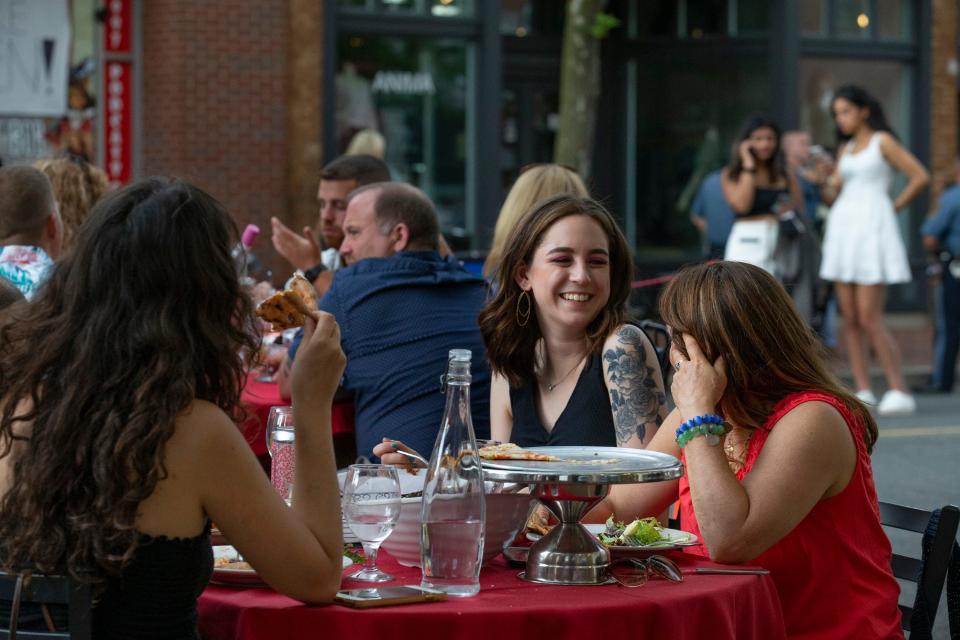 Diners in 2020 enjoy eating in Red Bank's Broadwalk, which was created during the pandemic to help restaurants survive.