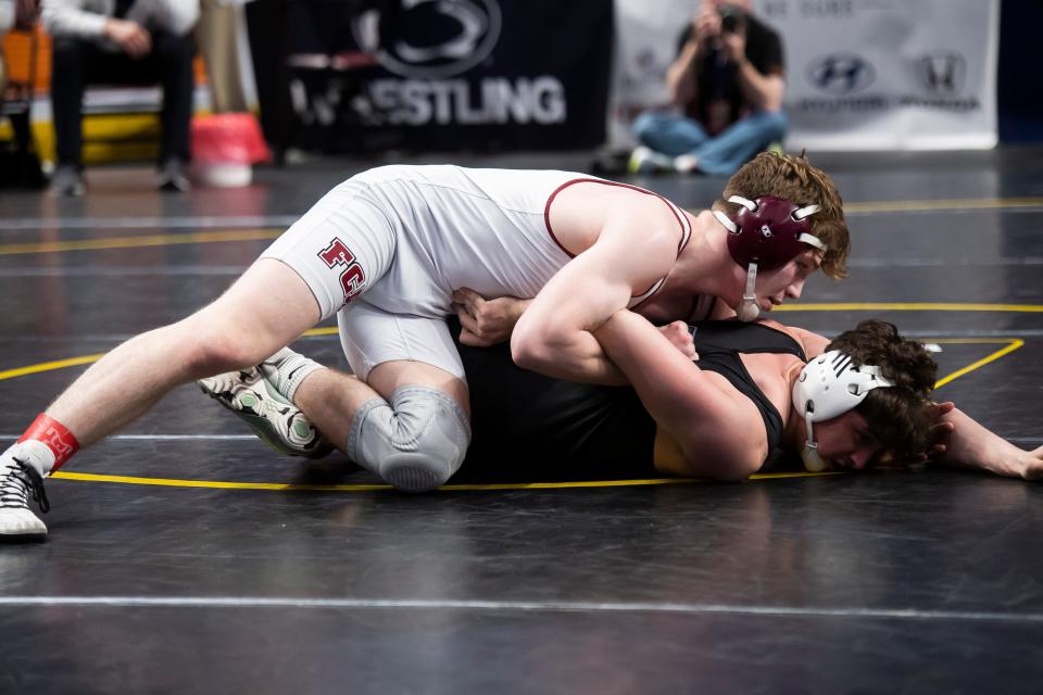 Faith Christian's Adam Waters (top) controls Berks Catholic's Carmine Lenzi during a 172-pound semifinal bout at the PIAA Class 2A Wrestling Championships at the Giant Center on March 8, 2024, in Hershey. Waters won by tech fall, 15-0, at 2:20.