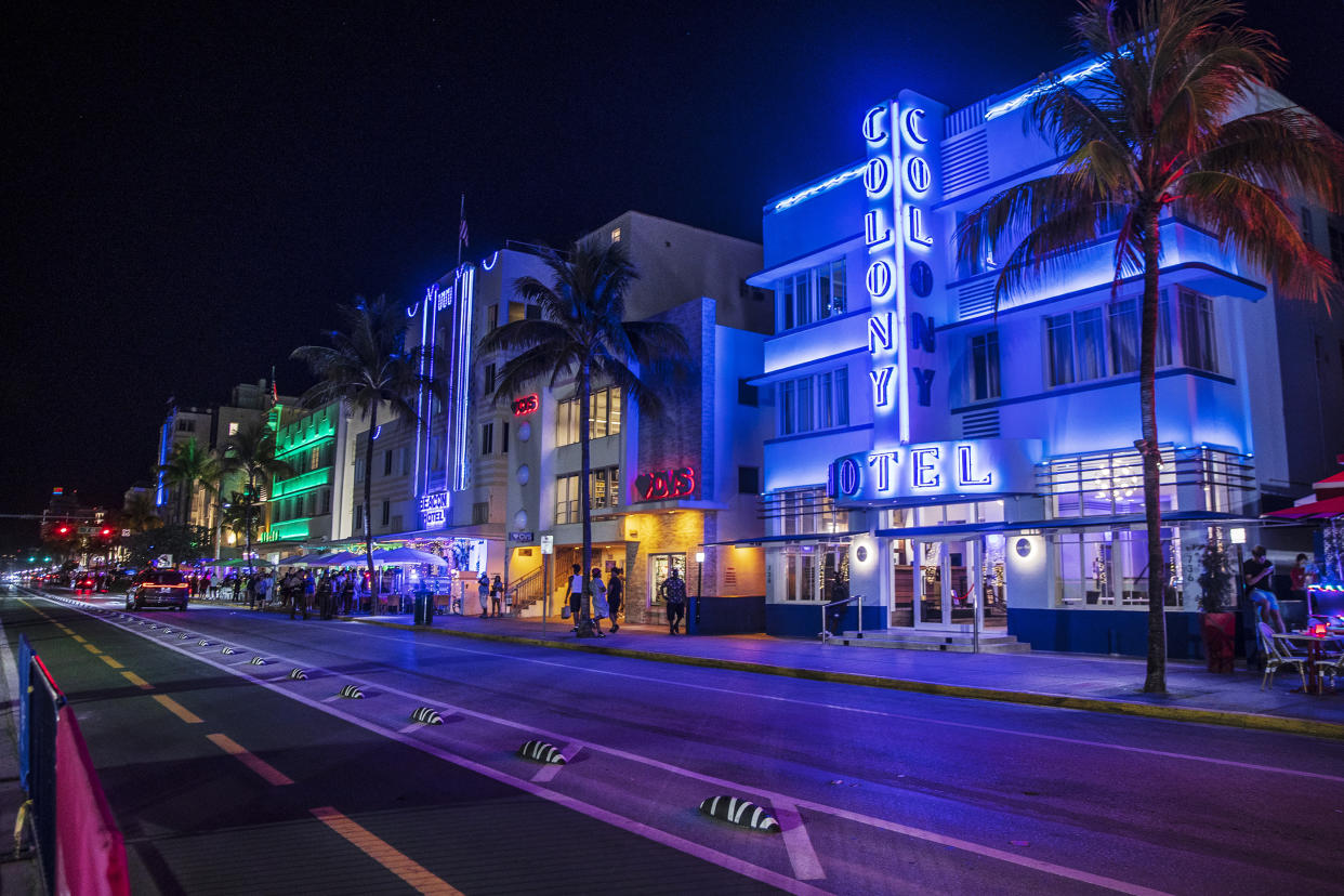 Some of the restaurants and bars on Ocean Drive are closed before the midnight curfew imposed by the City of Miami Beach, Fla., Saturday March 26, 2022. Miami Beach officials have spent recent years trying to control the raucous crowds, public drinking and growing violence associated with the city's world-famous South Beach neighborhood during spring break. (Pedro Portal/Miami Herald via AP)