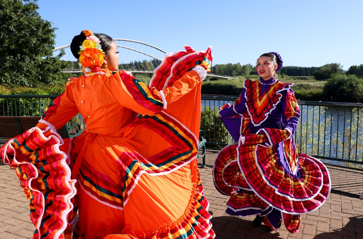 Marielena Melendez and Shila Gonzalez of Casa de la Cultura Tlanese prepare to perform during the World Beat Festival at Riverfront Park in Salem in June 2022.