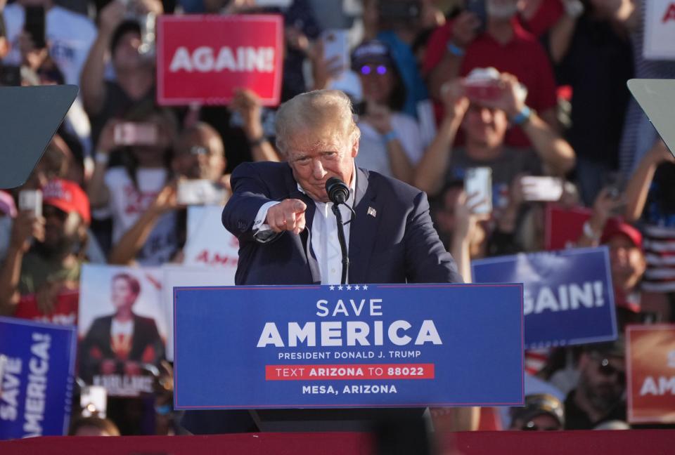 Former President Donald Trump speaks to people gathered at Legacy Sports Park in Mesa on Sunday, Oct. 9, 2022. Trump is in town to rally for Kari Lake, Blake Masters and other local Republican ticket candidates.