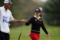 Sei Young Kim, of South Korea, reacts with her caddie after a birdie on the sixth green during the final round at the KPMG Women's PGA Championship golf tournament at the Aronimink Golf Club, Sunday, Oct. 11, 2020, in Newtown Square, Pa. (AP Photo/Matt Slocum)