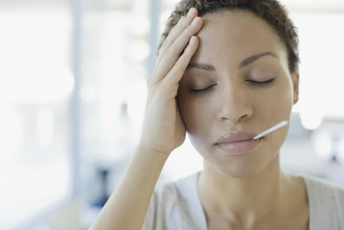 Using fever reducers or drinking too much fluid while battling the flu may upset the body's delicate balancing act. Sam Edwards/OJO Images via Getty Images