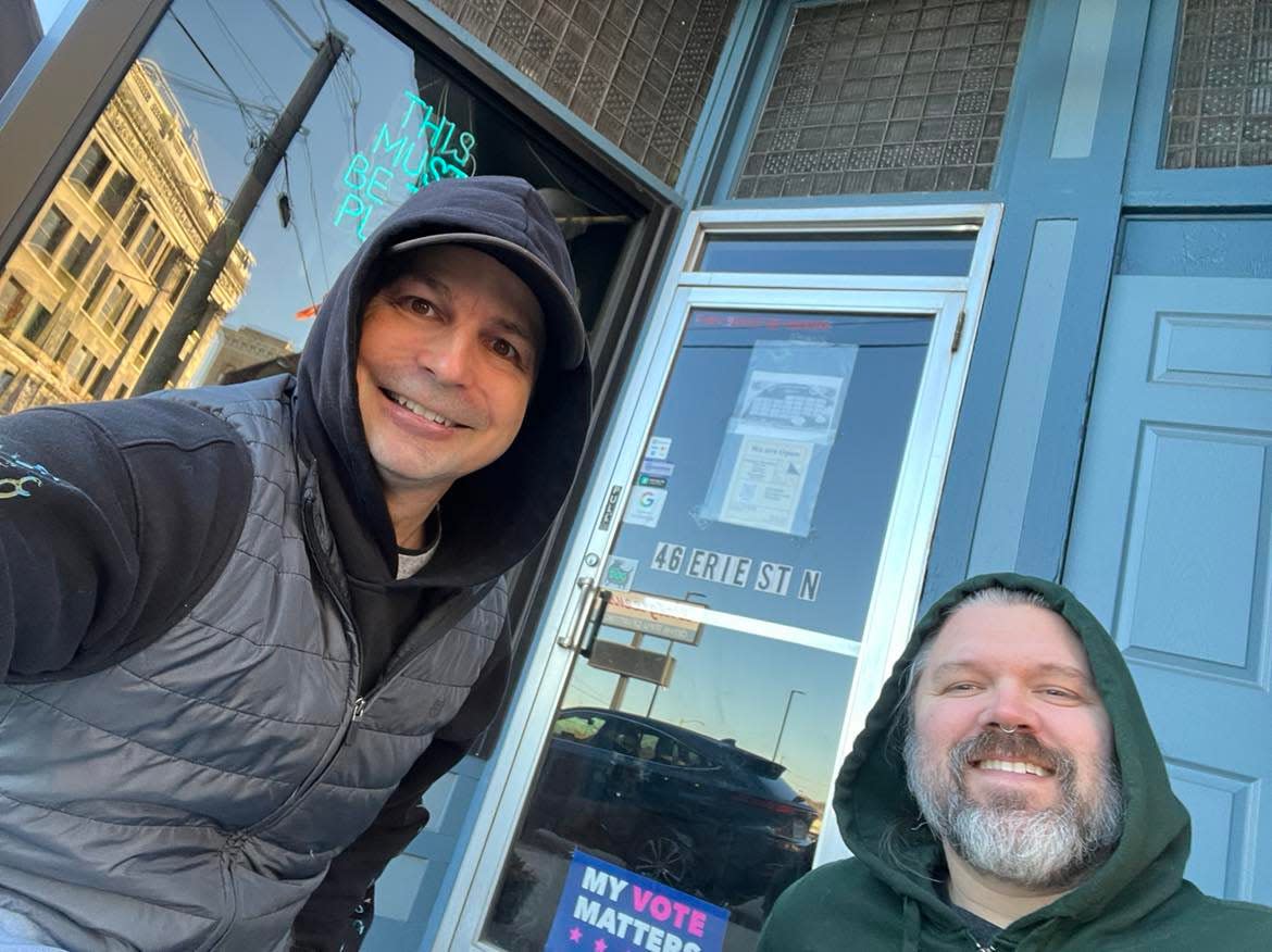 Ed Balint, The Canton Repository's entertainment writer, is shown with a fellow music fan who was waiting in line for Erie St Vinyl in downtown Massillon to open for the recent Small Business Saturday. Erie St Vinyl featured Record Store Day exclusive releases.