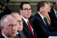 U.S. Trade Representative Robert Lighthizer (4thL), Treasury Secretary Steven Mnuchin (3rdL) and White House economic adviser Larry Kudlow (2ndL) pose for a photograph before the start of U.S.-China trade talks at the White House in Washington, U.S., February 21, 2019. REUTERS/Joshua Roberts