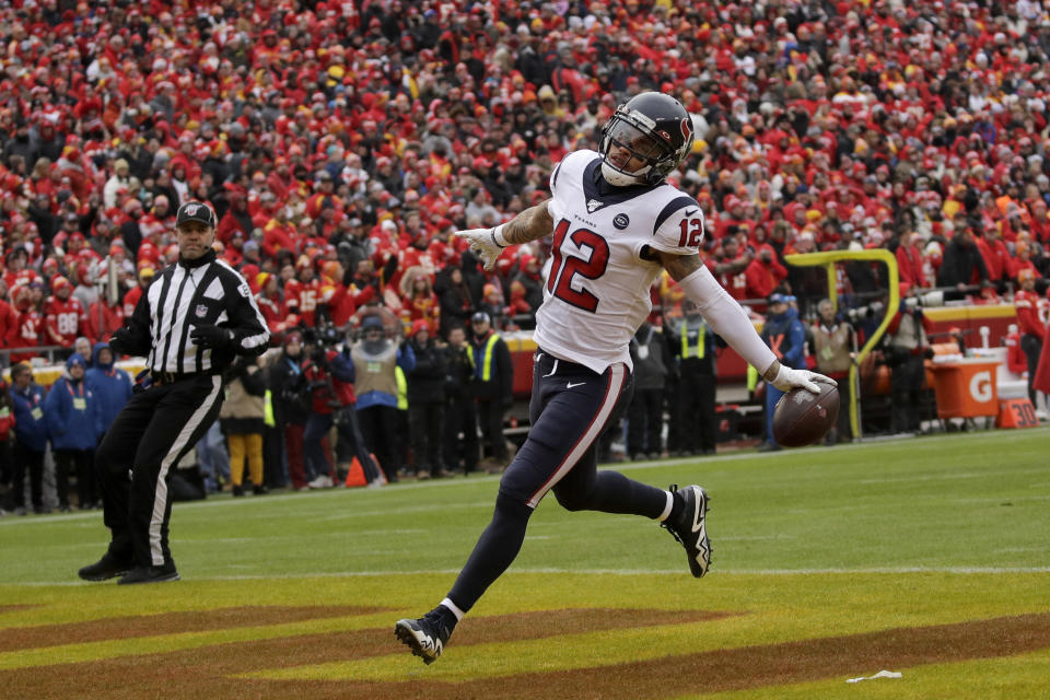 Houston Texans wide receiver Kenny Stills (12) scores a touchdown during the first half of an NFL divisional playoff football game against the Kansas City Chiefs, in Kansas City, Mo., Sunday, Jan. 12, 2020. (AP Photo/Charlie Riedel)