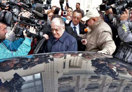 Ion Iliescu (C) is accused of 'contributing to the institution of a generalised psychosis'