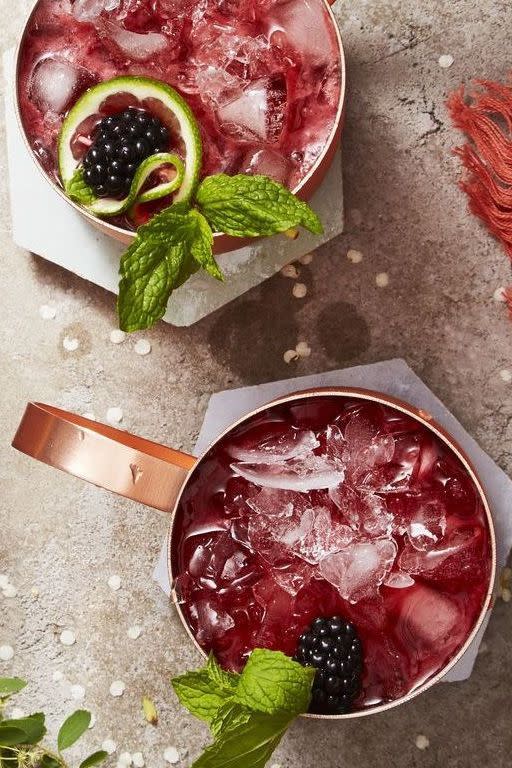 blackberry cocktail with fresh mint in a copper mug