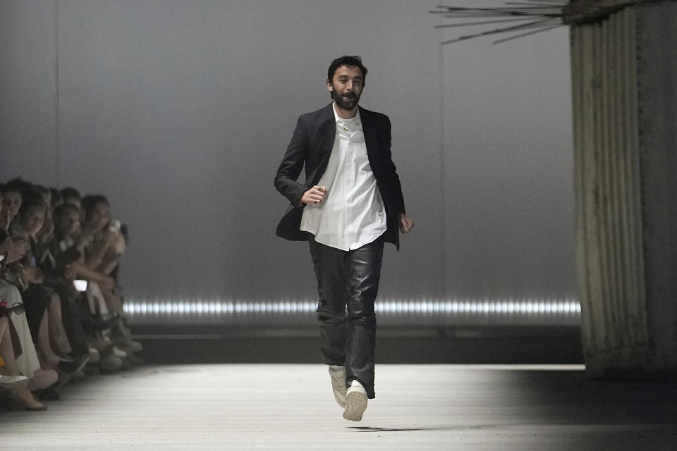 Creative director Walter Chiapponi runs an the runway at the end of the Tod's women's Fall-Winter 2023-24 fashion show presented in Milan, Italy, Friday, Feb. 24, 2023. (AP Photo/Luca Bruno)