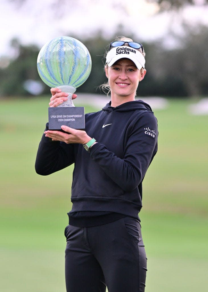 Nelly Korda poses with the championship trophy after winning the LPGA Drive On Championship on Sunday.