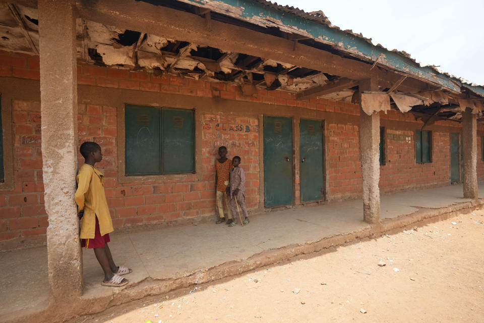 Children play at the LEA Primary and Secondary School Kuriga where students were kidnapped in Kuriga, Kaduna state, Nigeria, Saturday, March 9, 2024. The kidnapping on Thursday was only one of three mass kidnappings in northern Nigeria since late last week, a reminder of the security crisis that has plagued Africa's most populous country. No group claimed responsibility for any of the abductions but two different groups are blamed. (AP Photo/Sunday Alamba)