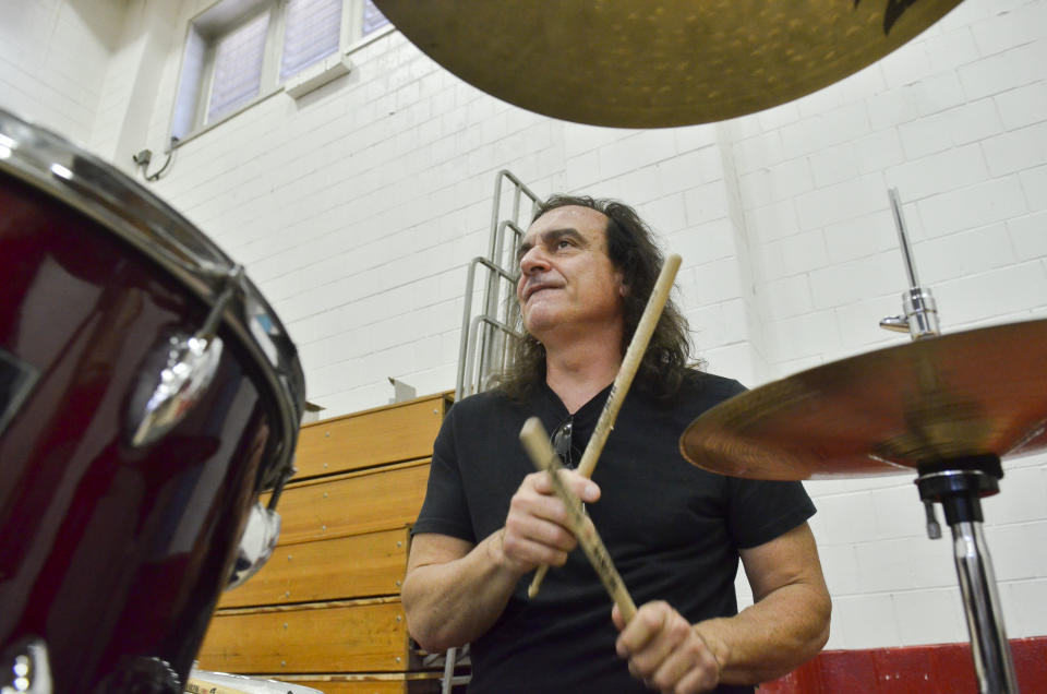 Vinny Appice takes his turn on the drum kit. He and his brother play with their sticks backwards to produce a "thicker sound" and to have less risk of breaking them.