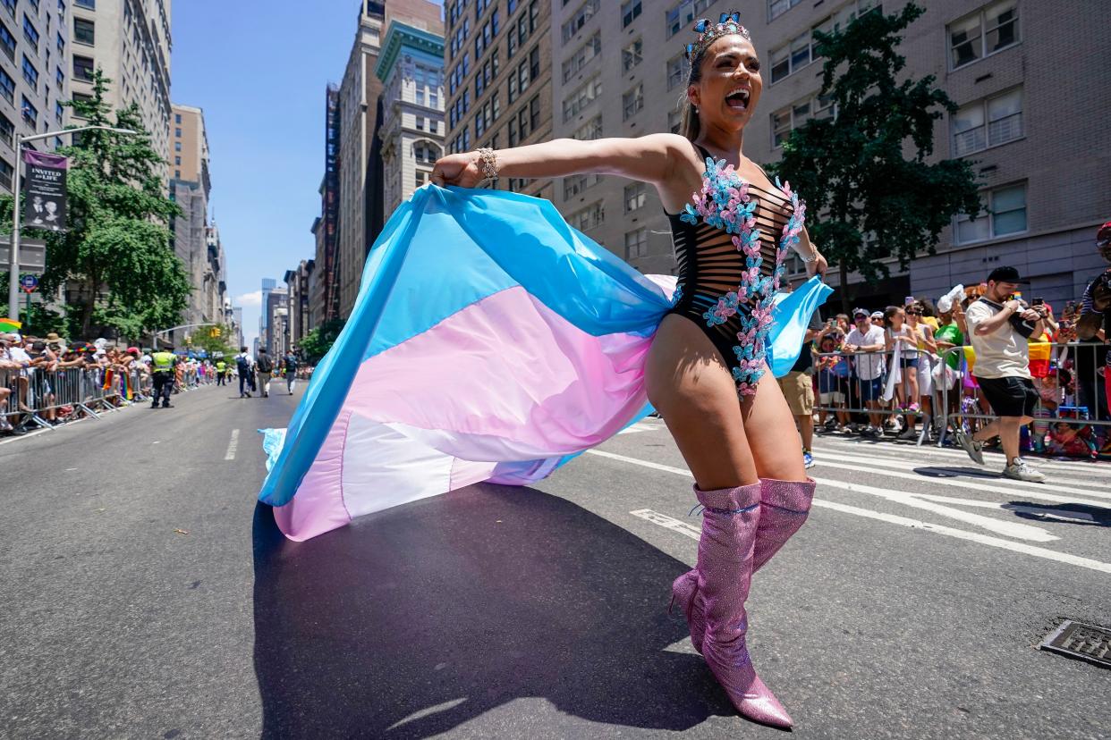 A reveler marches down Fifth Avenue during the annual NYC Pride March, Sunday, June 26, 2022, in New York. 