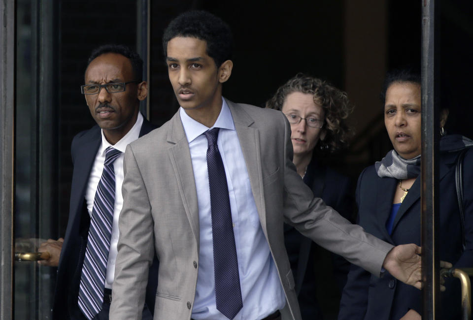 Robel Phillipos, a college friend of Boston Marathon bombing suspect Dzhokhar Tsarnaev, leaves federal court after a hearing Tuesday, May 13, 2014, in Boston. Phillipos, of Cambridge, Mass., is charged with lying to investigators after last year's fatal bombing. Judge Douglas Woodlock ruled Tuesday that separate trials will be held for Phillipos and two other of Tsarnaev's friends, Azamat Tazhayakov and Dias Kadyrbayev, but that their trials do not need to be moved out of Massachusetts. (AP Photo/Stephan Savoia)