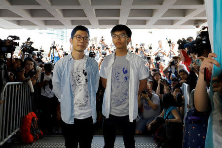 Student leaders Nathan Law and Joshua Wong arrive at the High Court to face verdict on charges relating to the 2014 pro-democracy Umbrella Movement, also known as Occupy Central protests, in Hong Kong, China. REUTERS/Tyrone Siu