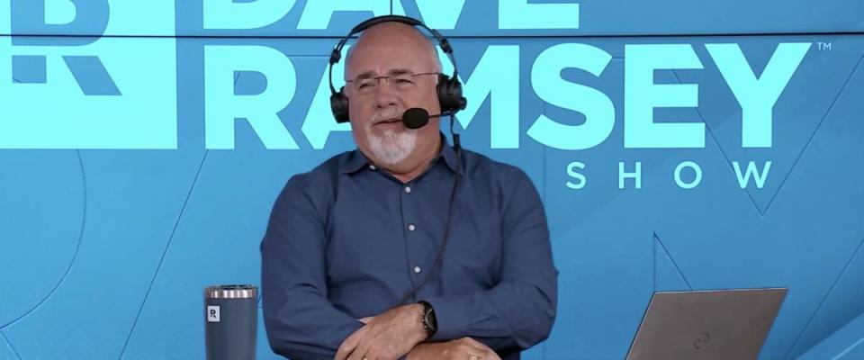 Dave Ramsey sitting on set of his radio show, wearing a headset