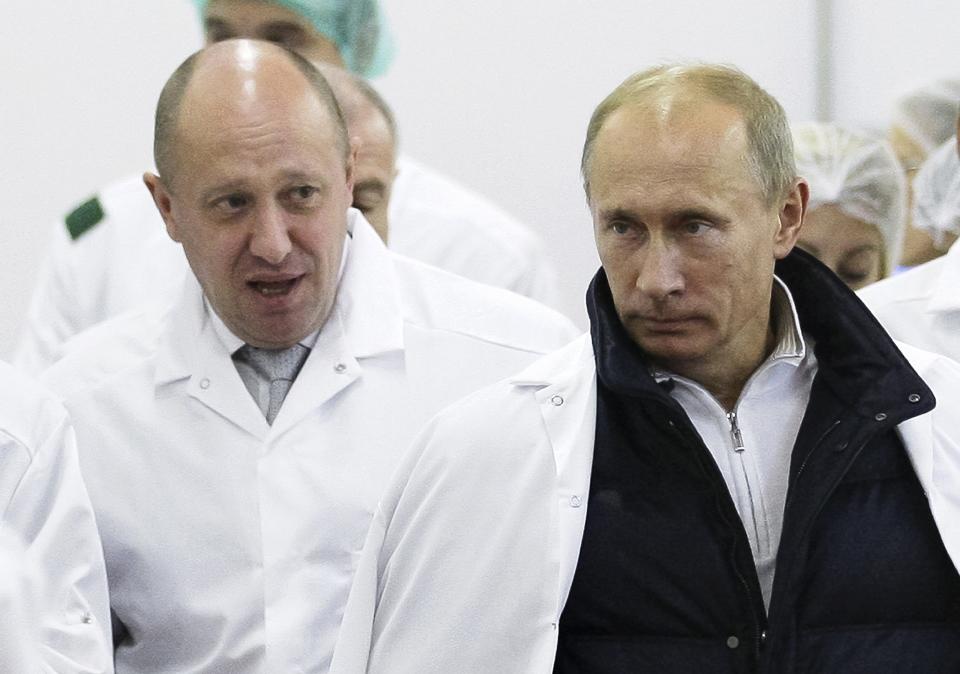 FILE - Businessman Yevgeny Prigozhin, left, shows Russian President Vladimir Putin, around his factory which produces school meals, outside St. Petersburg, Russia on Sept. 20, 2010. Prigozhin made his name as the profane and brutal mercenary boss who mounted an armed rebellion that was the most severe and shocking challenge to Russian President Vladimir Putin’s rule. (Alexei Druzhinin, Sputnik, Kremlin Pool Photo via AP, File)
