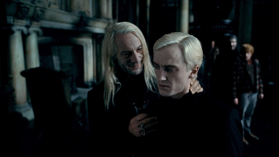 (L-r) JASON ISAACS as Lucius Malfoy and TOM FELTON as Draco Malfoy in Warner Bros. PicturesÕ fantasy adventure ÒHARRY POTTER AND THE DEATHLY HALLOWS Ð PART 1,Ó a Warner Bros. Pictures release.    Photo courtesy of Warner Bros. Pictures