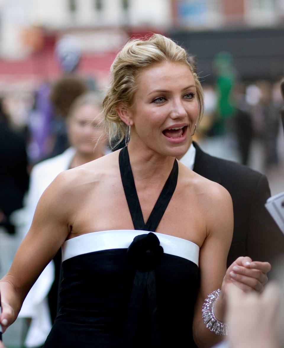 Cameron Diaz looks beautiful this black dress as she is caught on camera while speaking to someone
